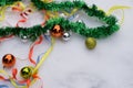 Christmas decorations are scattered on the table. Balls and garland of blue, golden and red colors on the table Royalty Free Stock Photo