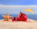 Christmas decorations seashells and starfish on a beach sand Royalty Free Stock Photo