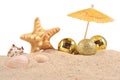 Christmas decorations seashells and starfish on a beach sand on Royalty Free Stock Photo