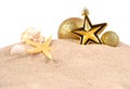 Christmas decorations seashells and starfish on a beach sand on Royalty Free Stock Photo