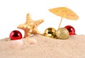 Christmas decorations seashells and starfish on a beach sand on Royalty Free Stock Photo