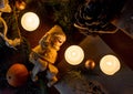 Christmas decorations. Set for greeting card: branch of fir tree, mandarin, candies in foil, cones, candle, snowman. Top