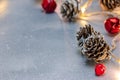 Christmas decorations. glowing holiday lights decorated with jingle bells and pine cones Royalty Free Stock Photo