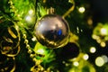 Christmas Tree with baubles and gold metallic ribbons Royalty Free Stock Photo