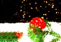 Christmas decorations on snow texture on black background with sparkles. Blurry effect. Copy space Royalty Free Stock Photo