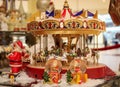 Christmas decorations and souvenirs. Musical Christmas carousel. Warm toned photo