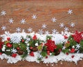 Christmas decorations and spruce branches on snow-covered a wooden background. Top view, copy space. Christmas or New Year Royalty Free Stock Photo