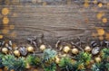 Christmas decorations and spruce branches on a wooden table. Top view, copy space. Christmas or New Year greeting card Royalty Free Stock Photo