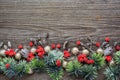 Christmas decorations and spruce branches on a wooden table. Top view, copy space. Christmas or New Year greeting card Royalty Free Stock Photo