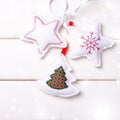 Christmas decorations with stars and tree on white wooden background. Xmas and Happy New Year composition. Square. Royalty Free Stock Photo