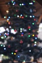 Blurred golden garland on Christmas tree, defocused background. Christmas abstract Royalty Free Stock Photo