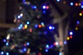 Blurred golden garland on Christmas tree, defocused background. Christmas abstract Royalty Free Stock Photo