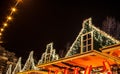 Christmas decorations on streets of night Amsterdam.