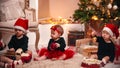 Christmas decorations in the studio - little babies playing with christmas toys