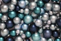 Christmas decorations, top view of pile of glass balls colored in blue, useful as a greeting gift card background Royalty Free Stock Photo