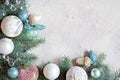 Christmas decorations toys in pastel colors for the Christmas tree and garlands on a gray background, festive mood. Royalty Free Stock Photo