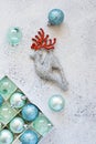 Christmas decorations toys for the Christmas tree blue balls, silver deer on gray background. Royalty Free Stock Photo