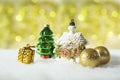 Christmas decorations, vintage house toy on golden bokeh background Royalty Free Stock Photo