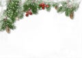 Christmas decorations on white  background. border with fir branches, red berries and cones. Copy space Royalty Free Stock Photo