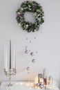 Christmas decorations on white background with candles, purple and silver. Royalty Free Stock Photo