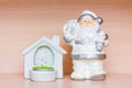 Christmas decorations, white ceramic figurine of santa claus and candle holder with tea candle Royalty Free Stock Photo