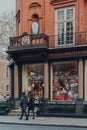 Christmas decorations in the windows of T. Goode Designers and Co shop in Mayfair, London, UK, people walking past Royalty Free Stock Photo