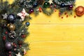 Christmas decorations on yellow wooden texture background Royalty Free Stock Photo
