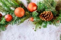 Christmas decorative ball on spruce branch on snow with copy space Royalty Free Stock Photo
