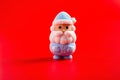 Christmas decorative doll of santa claus on red Royalty Free Stock Photo