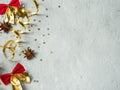 Christmas decorative red bow and gold ribbon on a gray concrete background copyspace Royalty Free Stock Photo