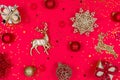 New Year and Christmas banner. Decorative Christmas toys, snowflakes, deer, balls and gift boxes on a red background. Royalty Free Stock Photo