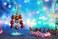 Christmas decorative tree decorated with red balls on a background of colored bokeh lights. Very soft, selective focus Royalty Free Stock Photo