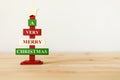 Christmas decorative wooden tree on table with copy space for text. A very Merry Christmas