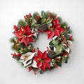Christmas decorative wreath of holly, ivy, mistletoe, cedar and leyland leaf sprigs with pine cones over white background. Royalty Free Stock Photo