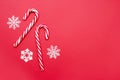 Christmas decors snowflakes and candy cane on red background