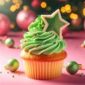 Christmas delicious cupcake with green whipped cream and star on pink background. Xmas homemade dessert