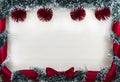 Christmas design-Christmas card bordered by pine and red balls and ribbon with bow, place for text.