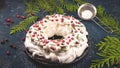 Christmas dessert Pavlova - meringue with whipped cream garnished with cranberries and rosemary. Royalty Free Stock Photo
