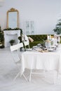 Christmas dining table with two chairs in the living room Royalty Free Stock Photo