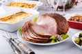 Christmas dinner with honey spiral sliced ham and side dishes Royalty Free Stock Photo