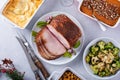 Christmas dinner with honey spiral sliced ham and side dishes Royalty Free Stock Photo