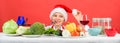 Christmas dinner idea. Healthy christmas holiday recipes. Woman chef or housewife cooking while wear santa hat. Best