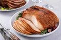 Christmas dinner main dishes, spiral sliced ham and roasted turkey breast Royalty Free Stock Photo