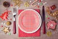 Christmas dinner plate setting with rustic decorations. View from above Royalty Free Stock Photo