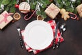 Christmas dinner plate, silverware, fir tree, gifts Royalty Free Stock Photo