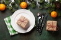 Christmas dinner plate, silverware, fir tree, oranges