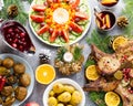 Christmas dinner with roasted meat steak, Christmas Wreath salad, baked potato, grilled vegetables, cranberry sauce