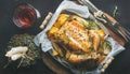 Christmas dinner with roasted whole chicken, decorative candles and wine Royalty Free Stock Photo