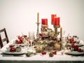 Christmas dinner setting in a light modern dining room. Winter holidays and celebration concept - table served for festive party Royalty Free Stock Photo