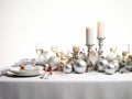 Christmas dinner setting in a light modern dining room. Winter holidays and celebration concept - table served for festive party Royalty Free Stock Photo